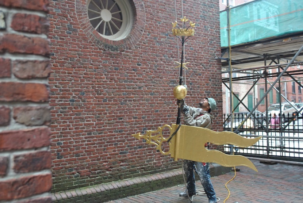 Old North Church's weathervane being reinstalled after maintenance work on the steeple.