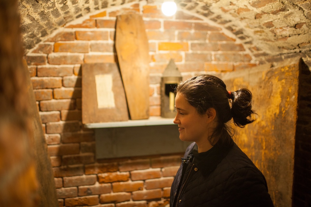 A visitor exploring Old North Church's crypt.