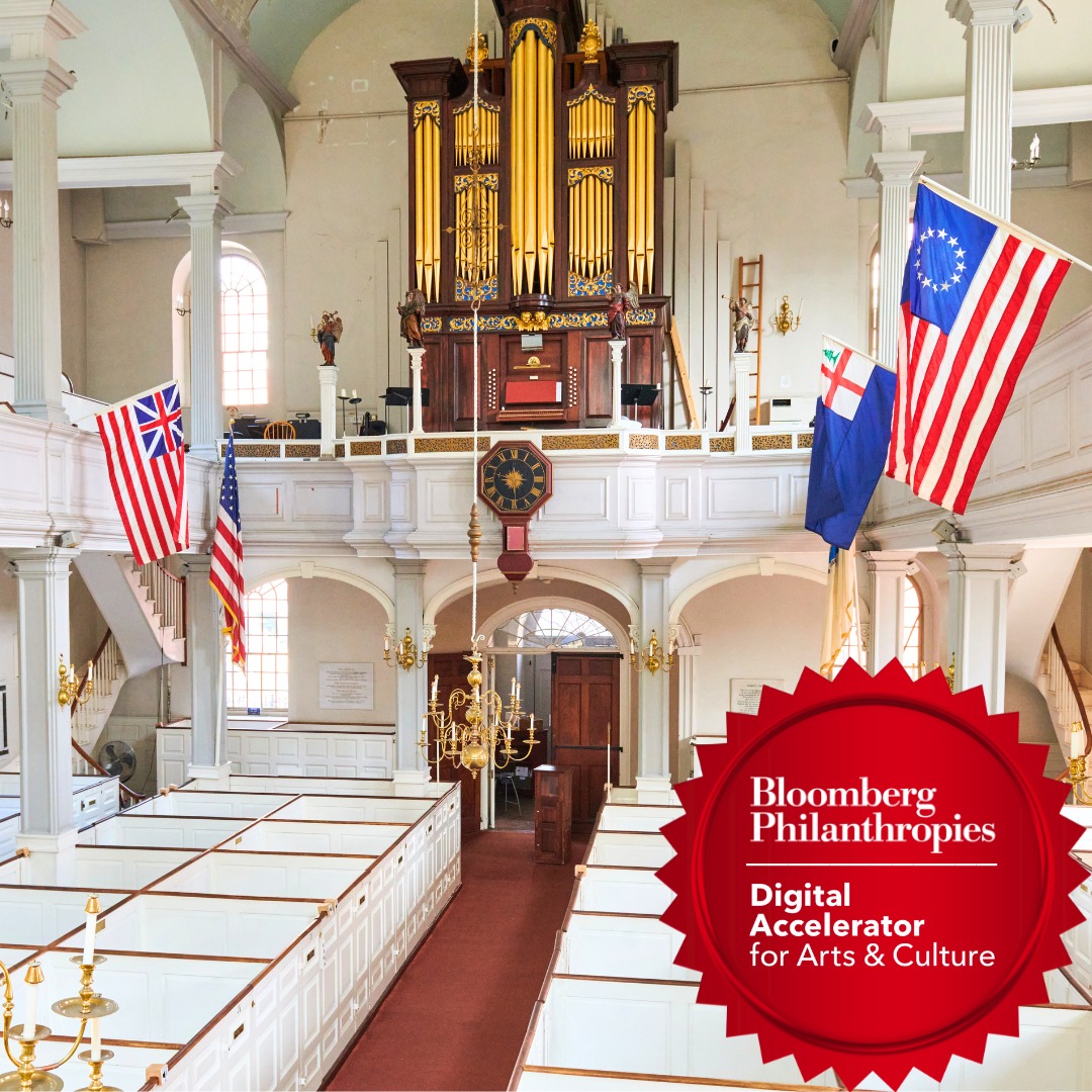 The sanctuary of the Old North Church with a digital badge for the Bloomberg Philanthropies Digital Accelerator.