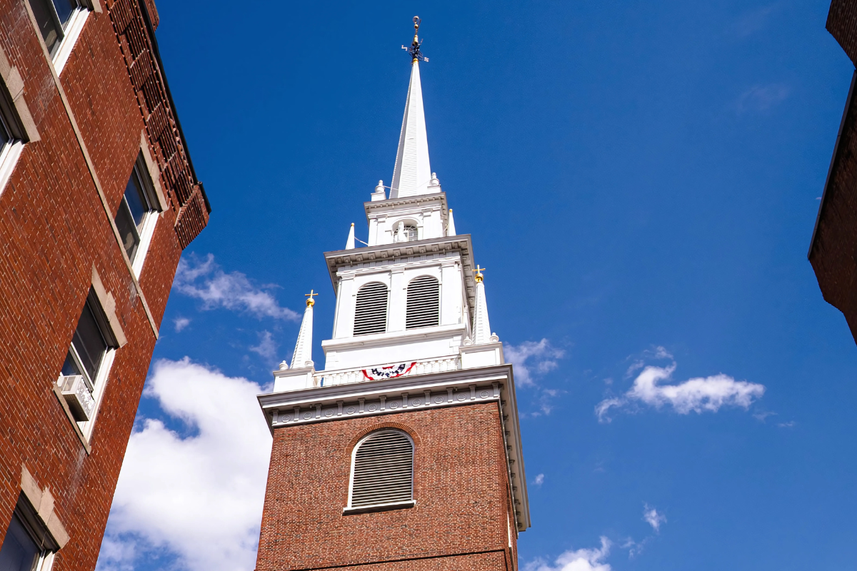 The Old North Church steeple with an American flag banner.