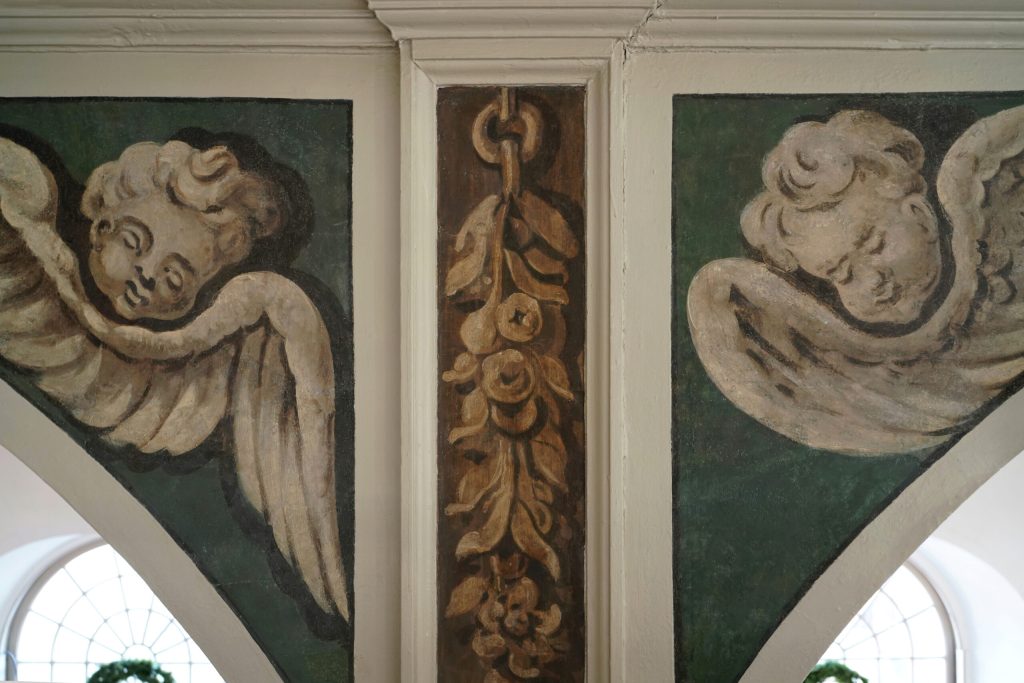 Newly restored angels and festoons in Old North Church's balcony arches.