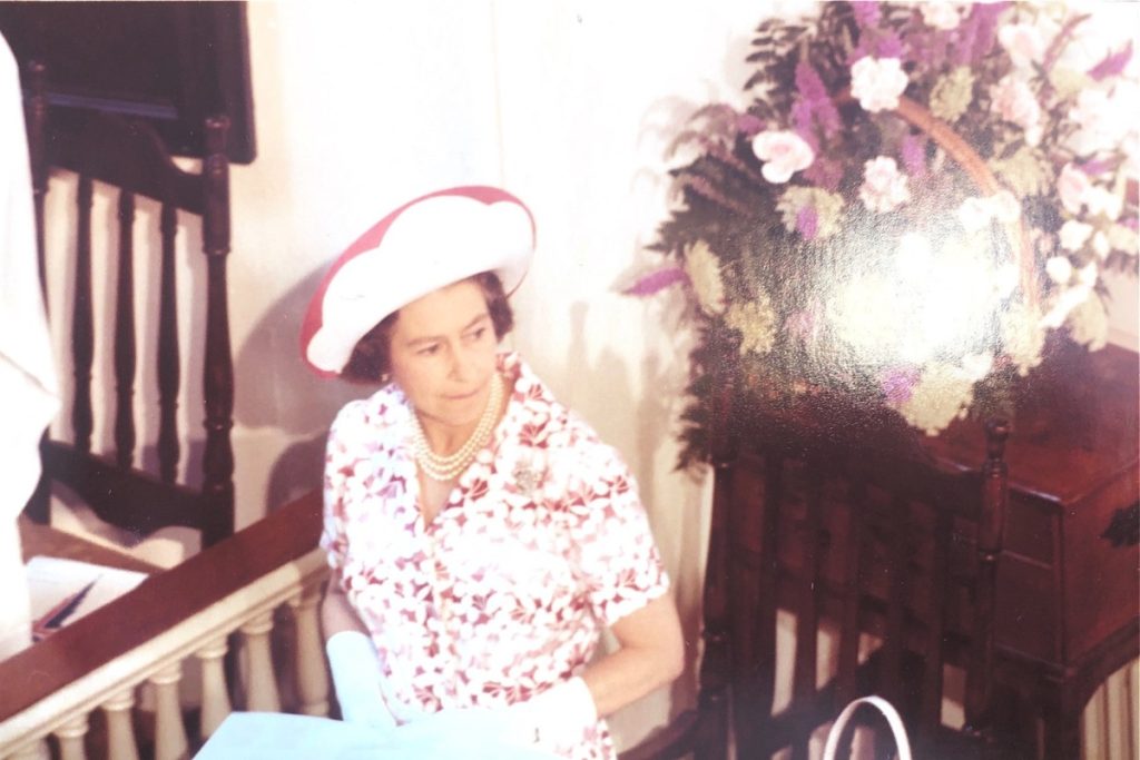 Queen Elizabeth II sitting in a chair at the Old North Church, 