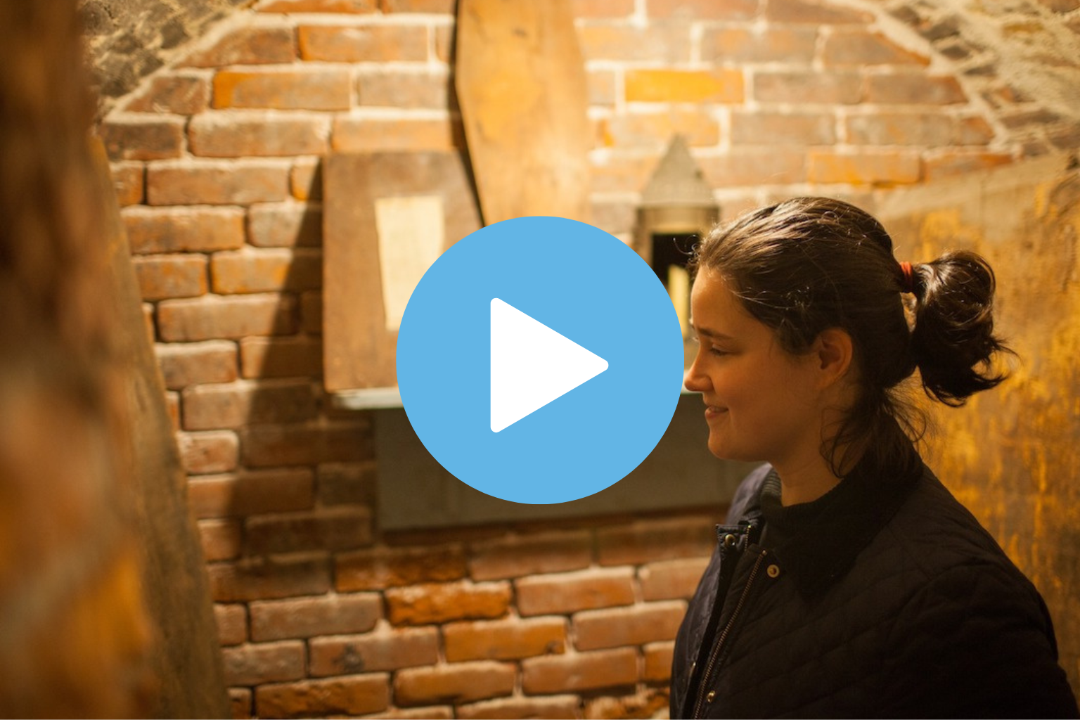 A woman exploring Old North Church's crypt.