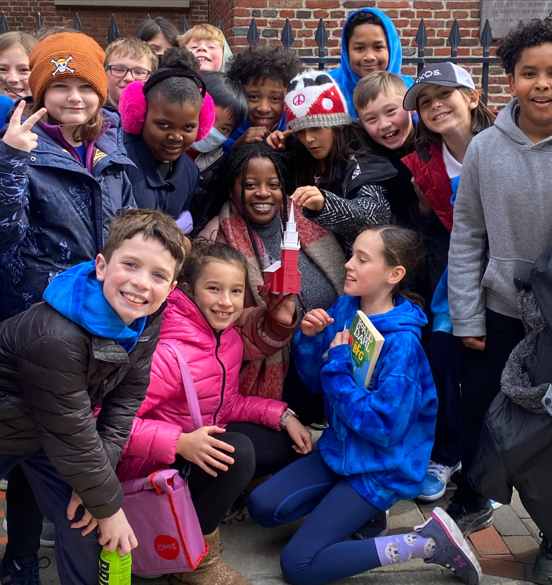 Students on a field trip with their teacher in front of the Old North Church.