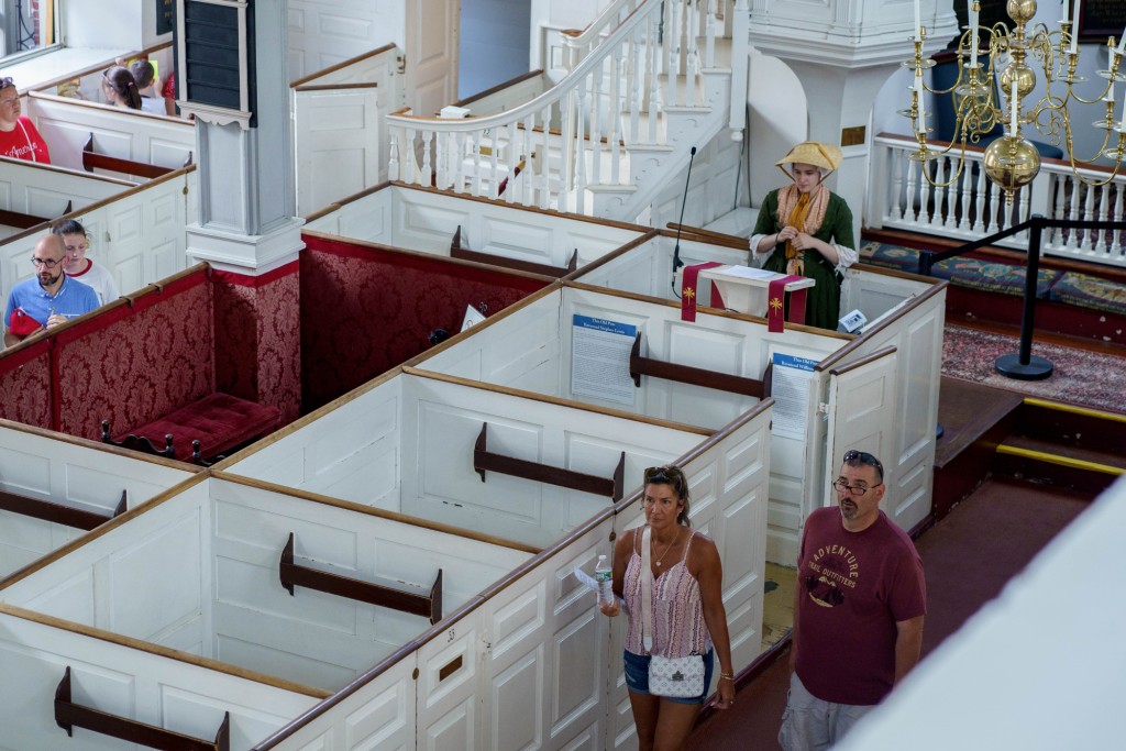 Visitors exploring the sanctuary of Old North Church in Boston.